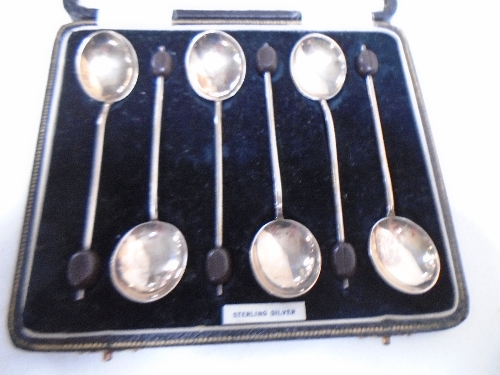 A set of six silver coffee bean spoons