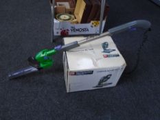 A Performance Compound mitre saw in box together with a Gtech cordless hedge trimmer.