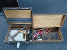 Two wooden tool boxes containing hand tools.