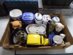 A box containing assorted Ringtons ceramics and tins including tea caddies, chintz tea china,
