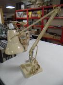 A mid century white metal angle poise lamp