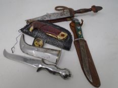 A Franklin Mint folding collector's knife together with African knife and two further knives in