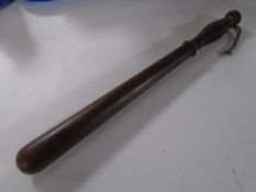 A wooden truncheon