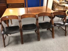 A set of four mid century Danish A-frame teak dining chairs, height 49 cm, width 76 cm.