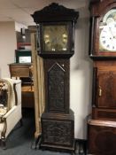 A 19th century heavily carved oak longcase clock by Clem Gowland of Sunderland,with pendulum,