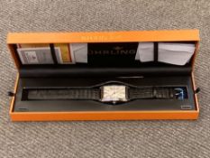 A Gentleman's Stuhrling in box, with warranty registration and paperwork.