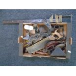 A box of vintage tools including a large vice, shoe lasts, saws etc.