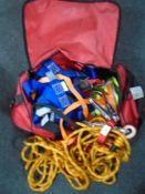 A holdall containing a large quantity of rope and straps.