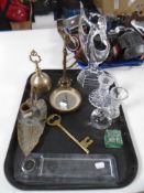 A tray containing brass items including a compass,