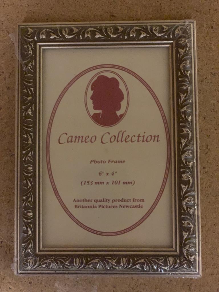 One crate containing fifty six Cameo Collection siver gilt finish 6" x 4" photo frames,