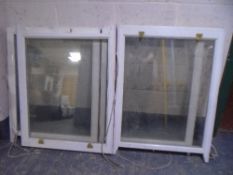 A pair of wooden framed sash windows.