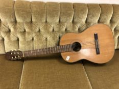 An Oscar Teller acoustic guitar
