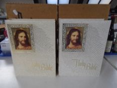 Two volumes of the Holy Bible fireside family editions