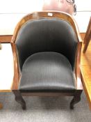 A 19th century mahogany framed tub chair in black fabric