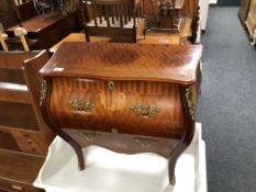 A continental two drawer bombe chest with gilt metal mounts., height 65 cm, width 68 cm.