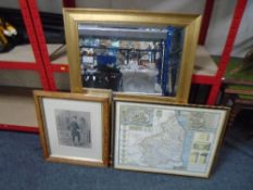 A bevel edged mirror in gilt frame together with a map of Northumberland in hogarth frame and a
