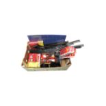 A box containing assorted Hornby accessory packs, crossing barrier,