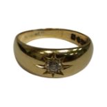 An 18ct yellow gold ring set with a diamond approximately 3 mm in diameter, 7.5g, size Q.
