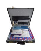A leather case containing Freemason's regalia, books and medals.