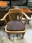 An Edwardian oak smoker's armchair