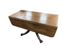 A 19th century mahogany flap sided table fitted with a drawer on a four way pedestal.
