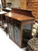 An Edwardian inlaid mahogany shaped display cabinet