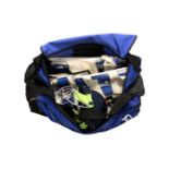 A Kukuburra cricket bag containing helmet, pads, cricket balls,