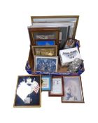 A box of framed pictures and prints, paraffin lamp,
