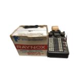 A vintage Burroughs adding machine together with a Raynox 8mm projector (boxed).