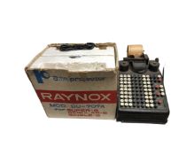 A vintage Burroughs adding machine together with a Raynox 8mm projector (boxed).