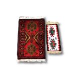 An Afghan rug, 68cm by 42cm, and one smaller.