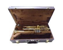 A brass Sonata trumpet in case