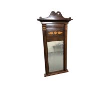 A 19th century mahogany hall mirror with pillar supports,