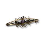 A 9 carat gold seed pearl and amethyst bar brooch. CONDITION REPORT: 2.