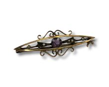 A 9 carat gold seed pearl and amethyst bar brooch. CONDITION REPORT: 2.