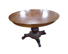 A 19th century continental oval mahogany breakfast table,