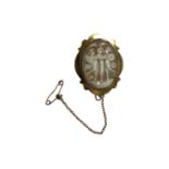 A 9ct yellow gold framed cameo brooch with safety chain, 25 mm x 32 mm.