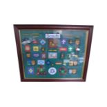 A scouting badge montage framed