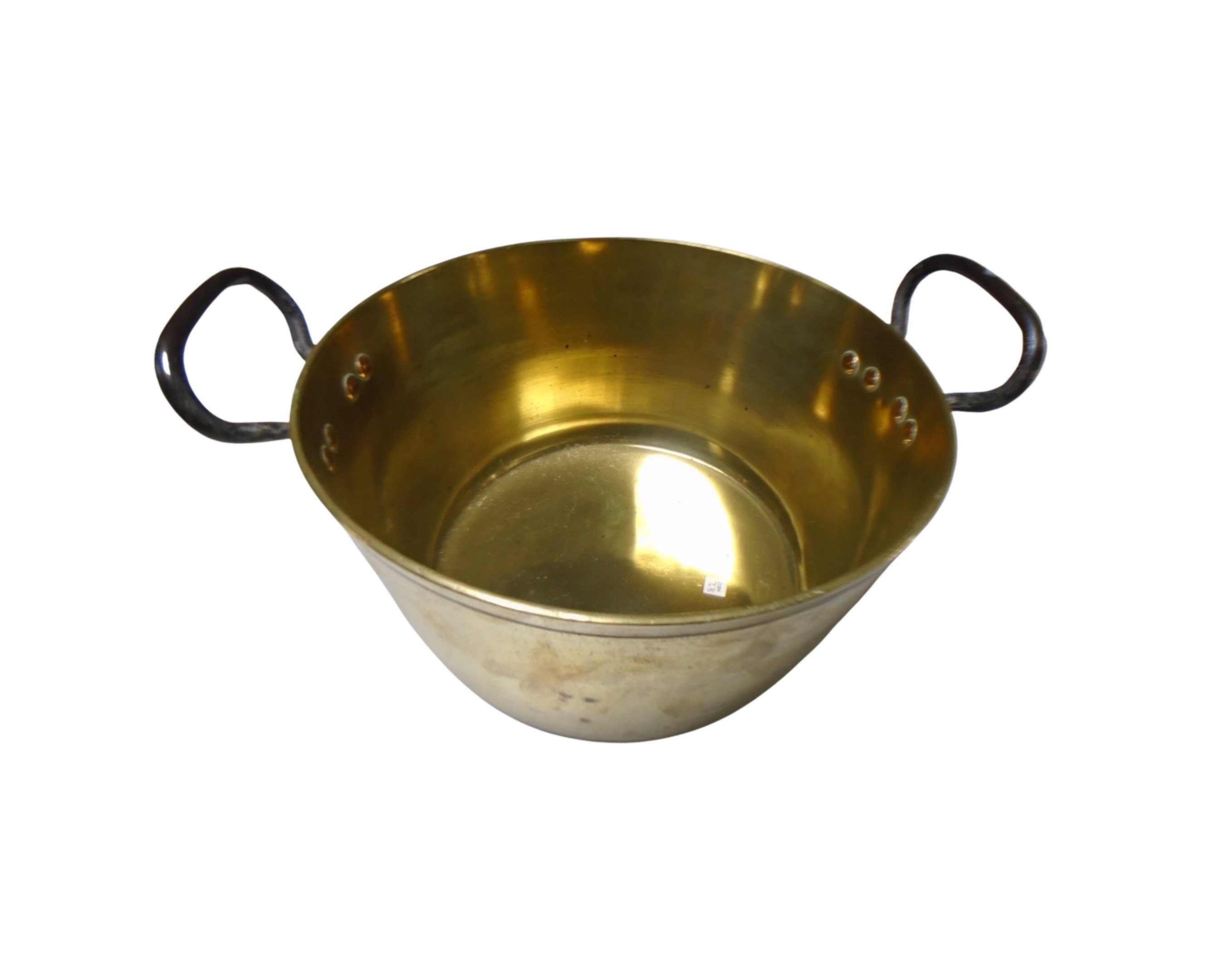 An antique brass jam pan with cast iron handle.