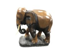 A carved tourist hardwood figure of an elephant