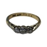 An 18ct gold and platinum three stone diamond ring, size N CONDITION REPORT: 2.