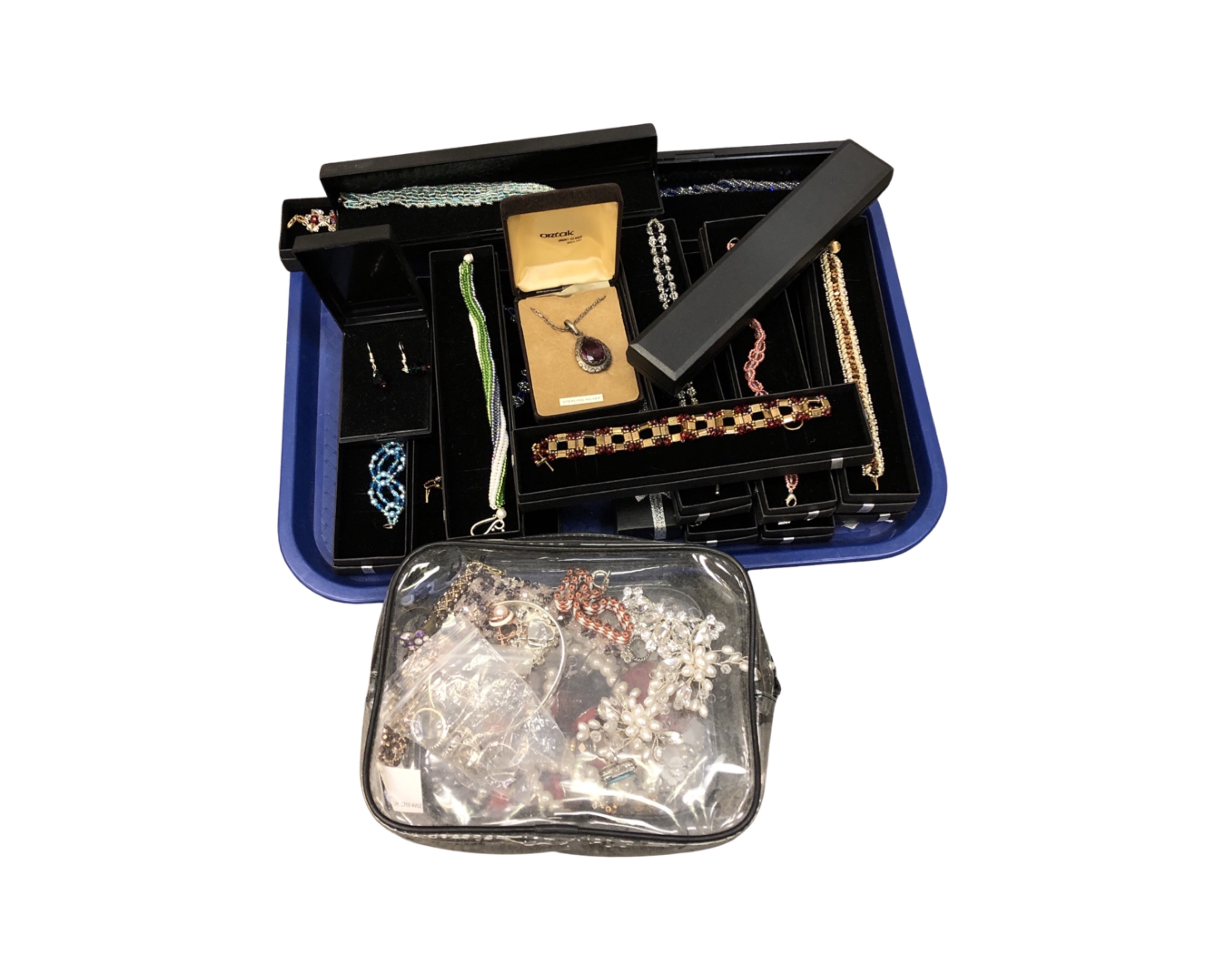 A tray containing a quantity of costume bracelets,