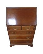 An Edwardian mahogany fall fronted five drawer bureau,