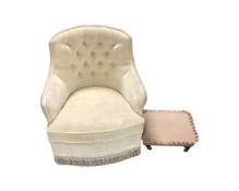 A bedroom chair upholstered in button dralon together with a footstool.