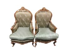 A pair of baroque style gilt wood armchairs in green fabric