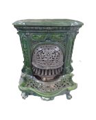 An antique French cast iron green enamelled fire