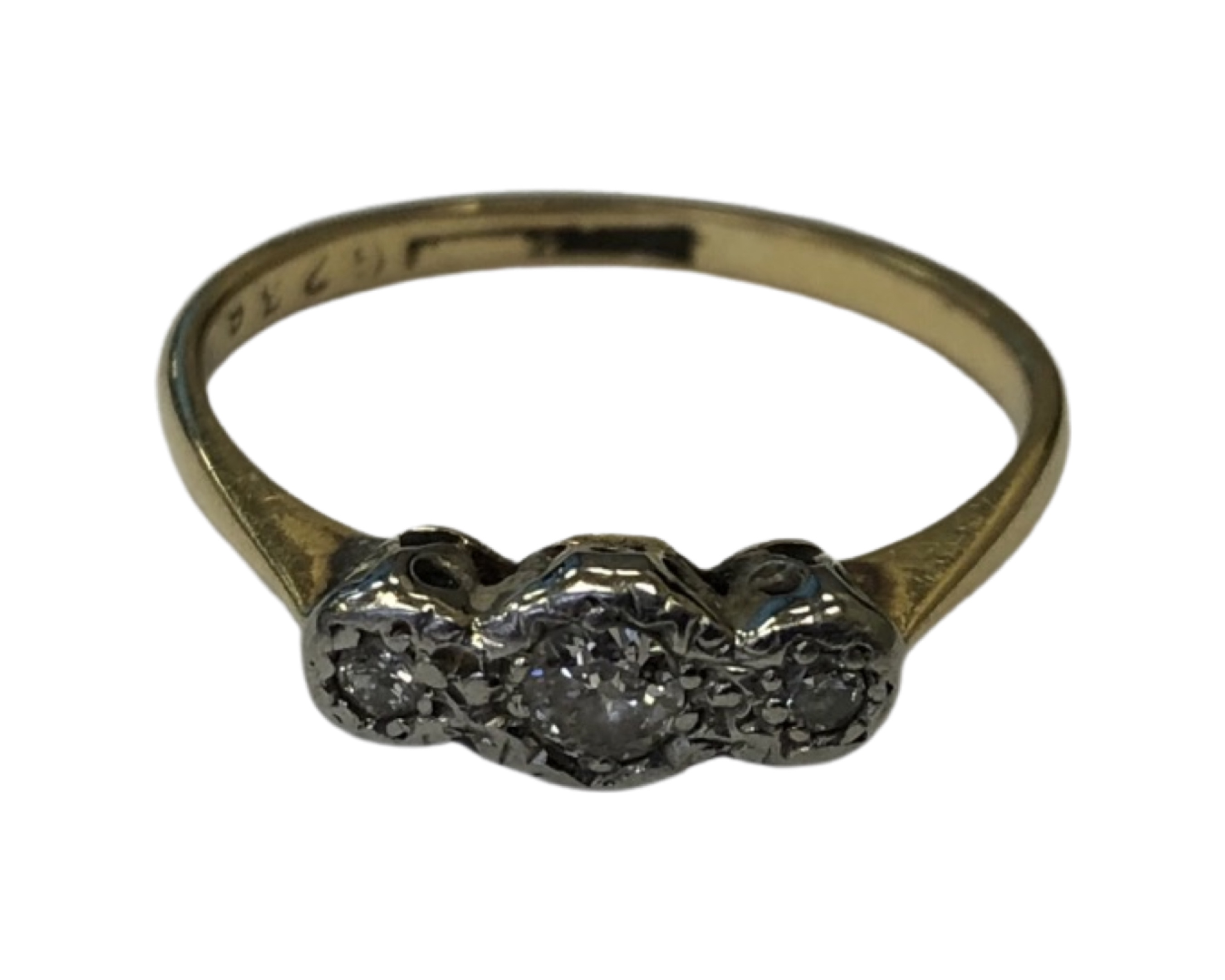 An 18ct gold and platinum three stone diamond ring, size M CONDITION REPORT: 1.