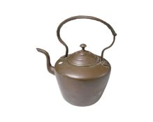 A Victorian copper kettle.