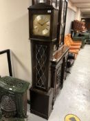 A continental longcase clock with leaded glass panel door