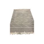 A contemporary kilim rug on grey ground,